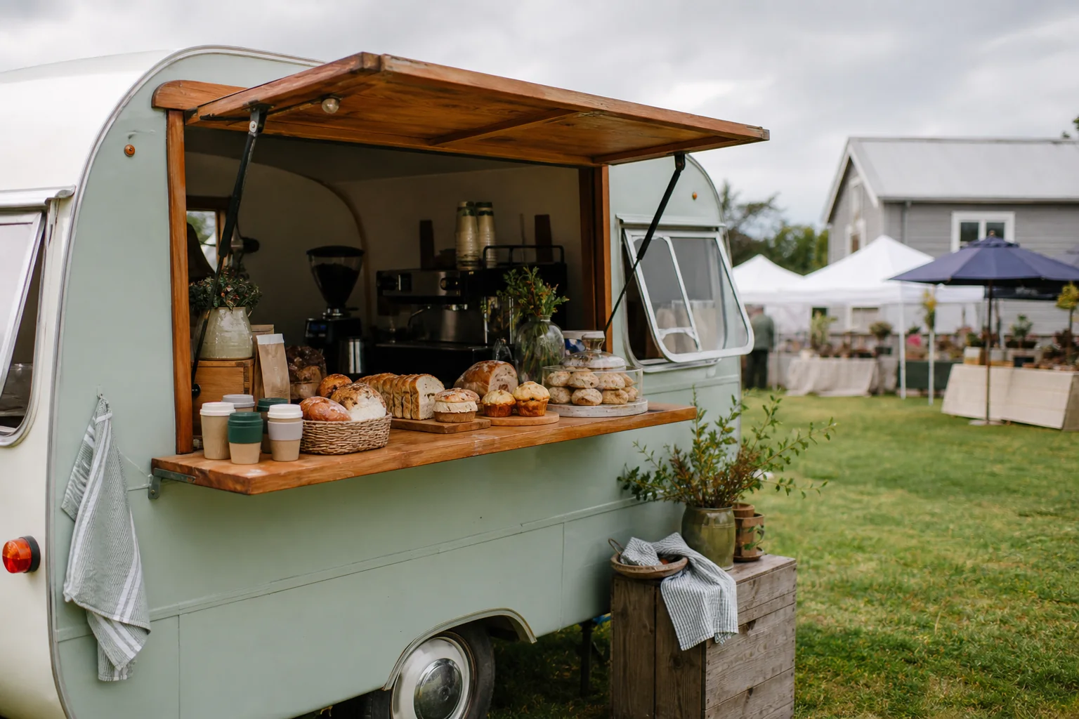 A mobile coffee and baking stall at a country market